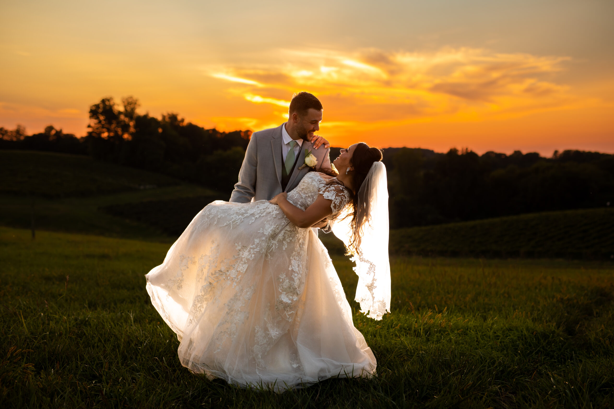 A gorgeous sunset photo of Melissa & Tyler at Linganore Wine Cellars in Mt. Airy, Maryland. Maryland wedding photographers know that sunset wedding photos are an essential part of any wedding day. Couples looking for wedding photography prices and wedding photographers in Maryland also know that they want to see amazing photos and be able to find out what the photographer prices are.